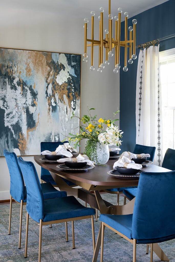 dining room with blue upholsted chairs and a dark wooden dining table. Minneapolis, MN